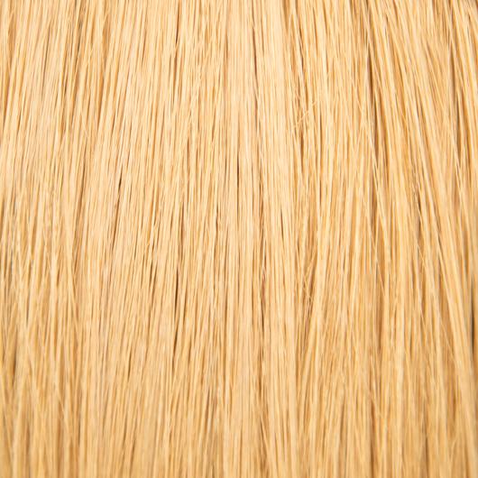 Beautiful brunette woman with long, I-Tip 20 inch hair extensions, showcasing the natural look and seamless blend with her own hair
