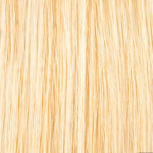 Beautiful woman with long, flowing hair wearing 20 inch tape hair extensions