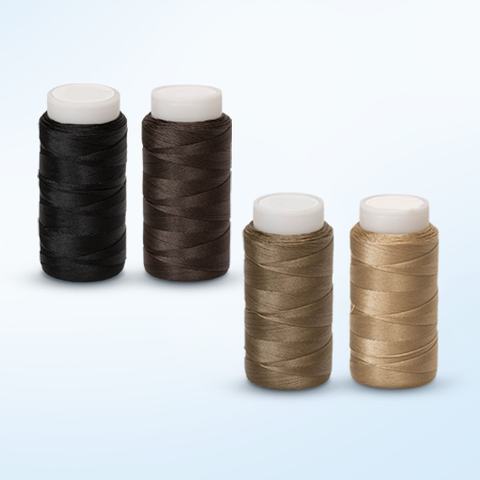 Nylon thread spools in various colors, perfect for sewing projects
