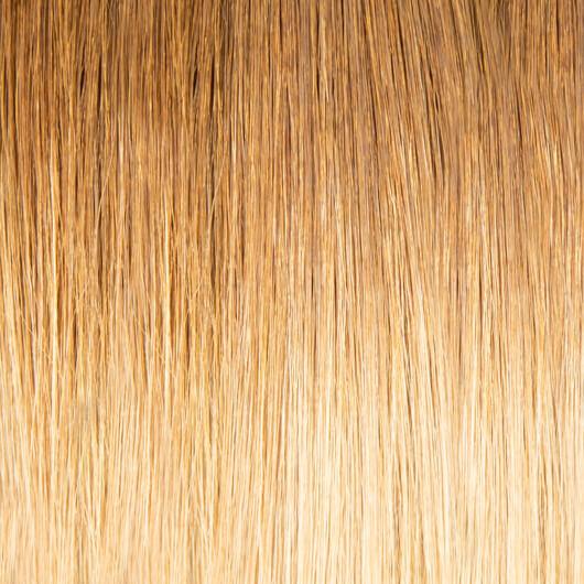 Long, straight 20 inch tape hair extensions in a natural brunette shade