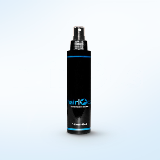 A close-up image of a bottle of Tape-In Solvent, a gentle and effective adhesive remover for hair extensions